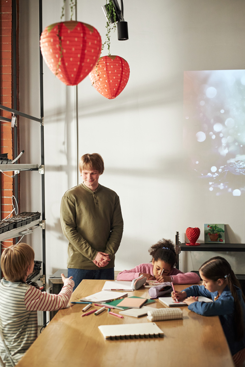 Image: A teacher in the classroom with students