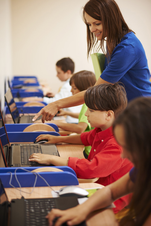 Image: A teacher in the classroom with students